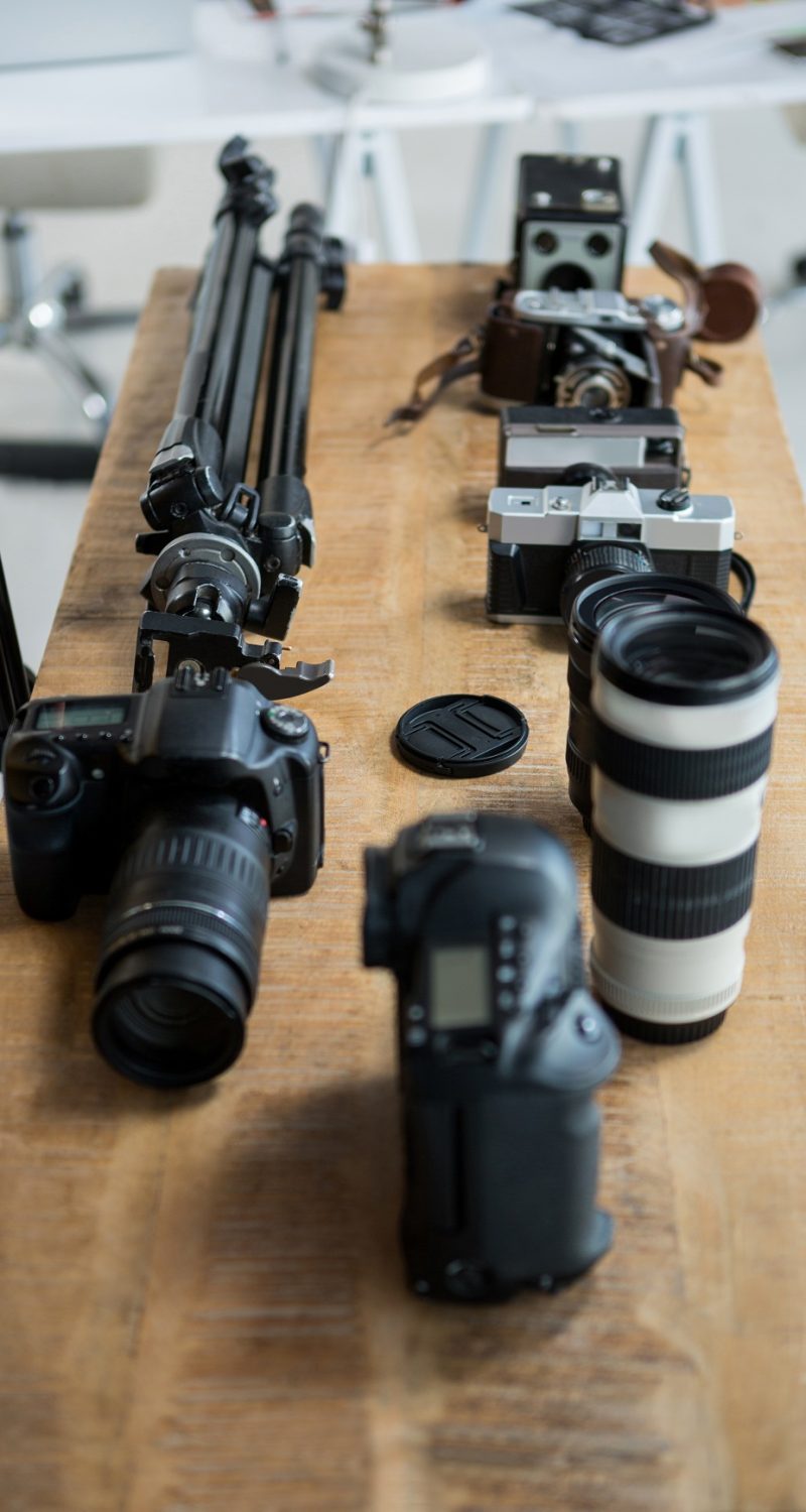 close-up-of-digital-camera-and-tripod-stand-on-tab-NT2VGXS.jpg